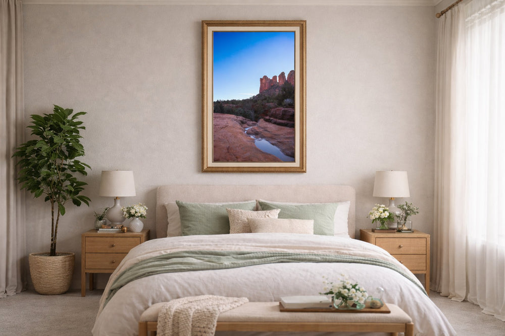 Bedroom with a large framed picture of a natural landscape on the wall